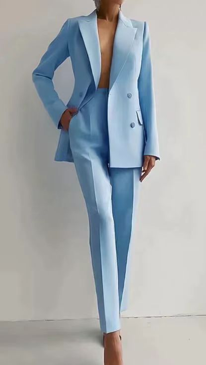 Light blue suit worn by a person on a plain background