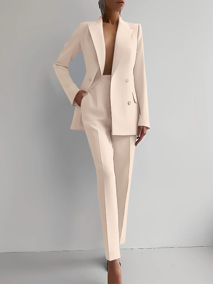 Beige suit worn by a person on a plain background