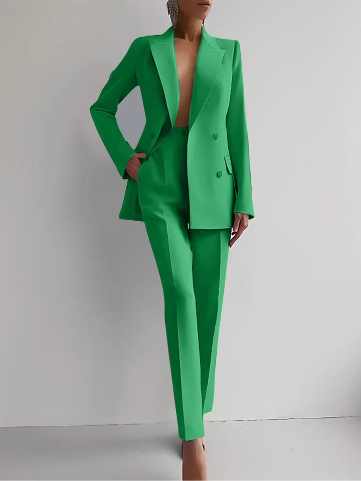 Green suit worn by a person on a plain background