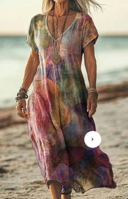 Woman wearing a colorful dress on a beach