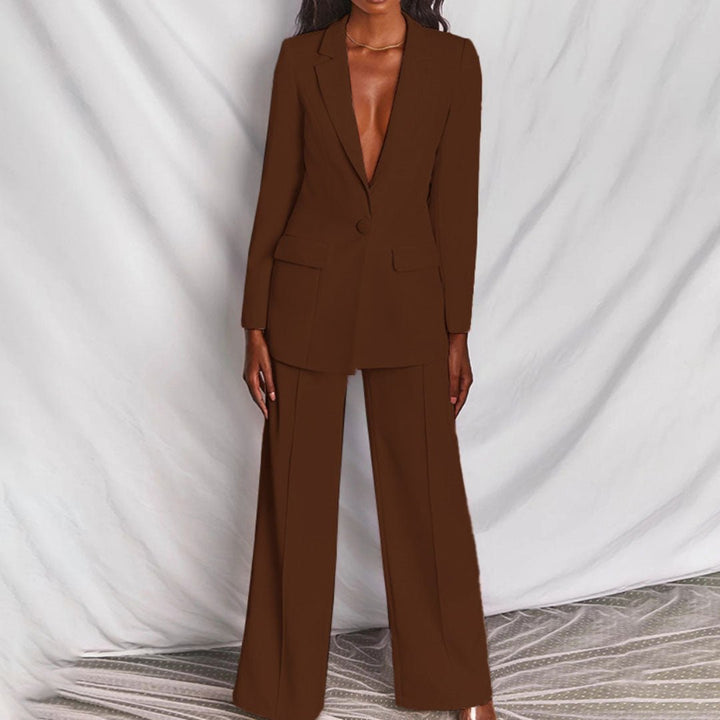 Brown suit worn by a model against a white draped curtain background