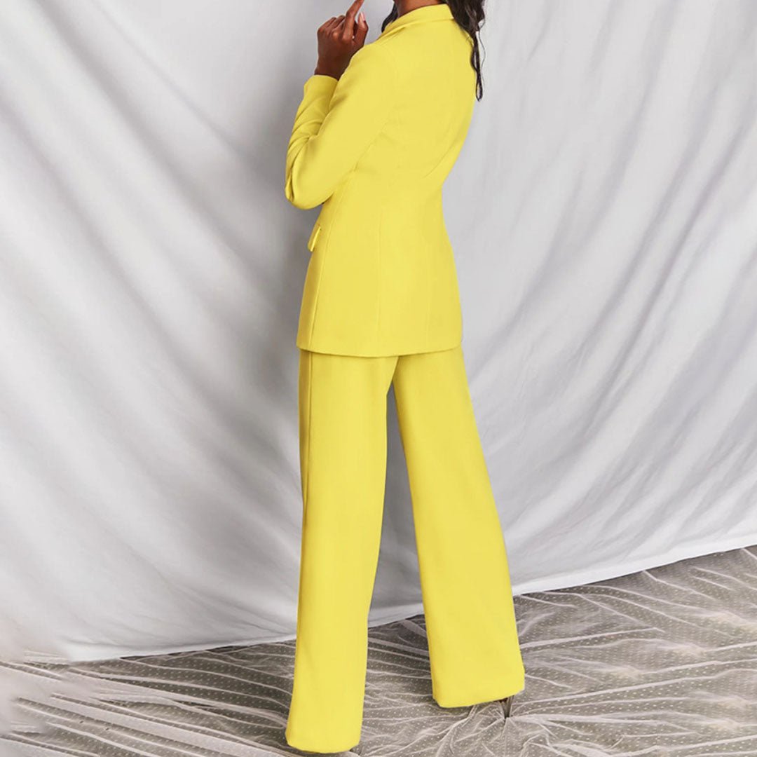Person wearing a bright yellow suit against a white background
