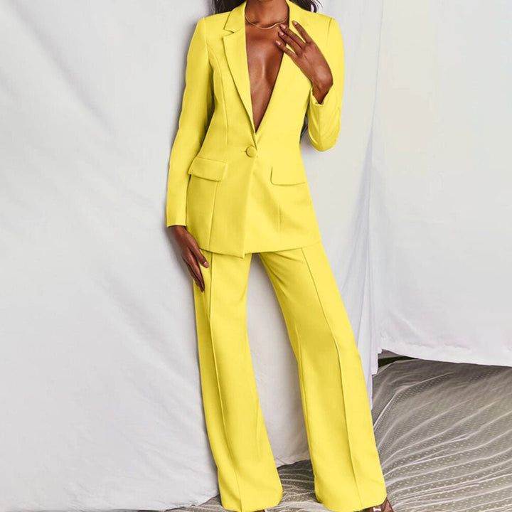 Person wearing a bright yellow suit against a neutral background