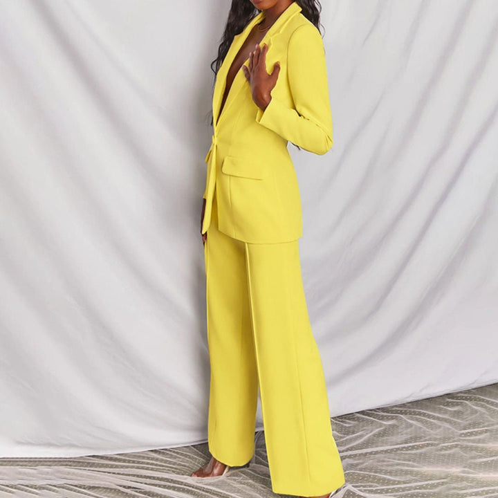 Person wearing a bright yellow suit against a plain background