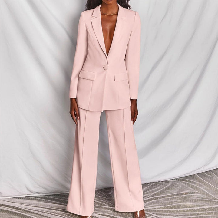 Pink suit worn by a model against a plain background