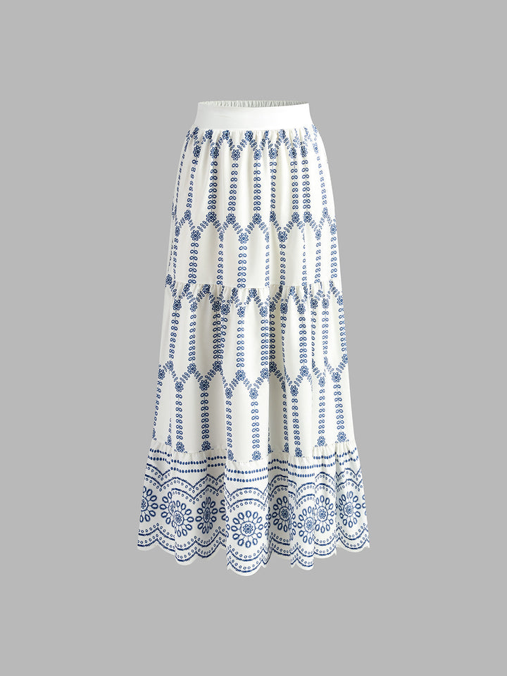 White skirt with blue geometric pattern on a gray background