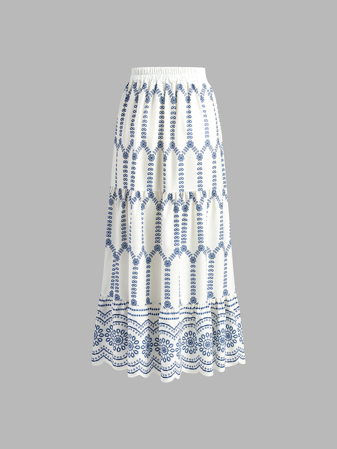 White skirt with blue pattern on a gray background