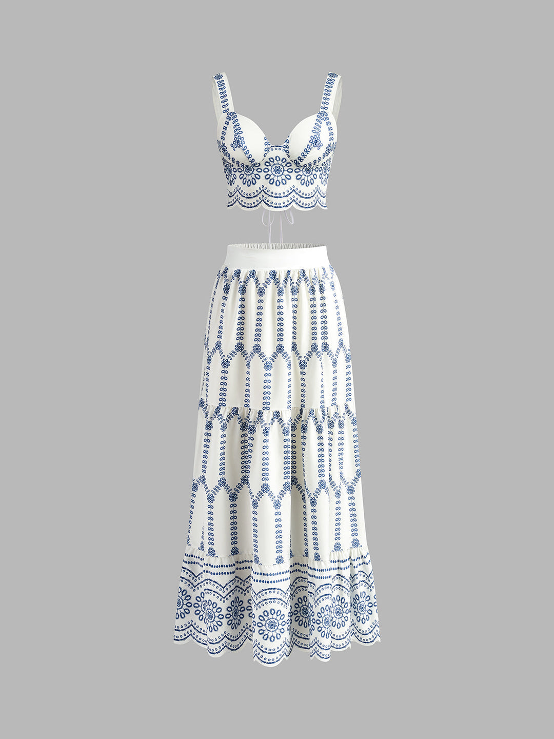 White dress with blue geometric pattern on a gray background