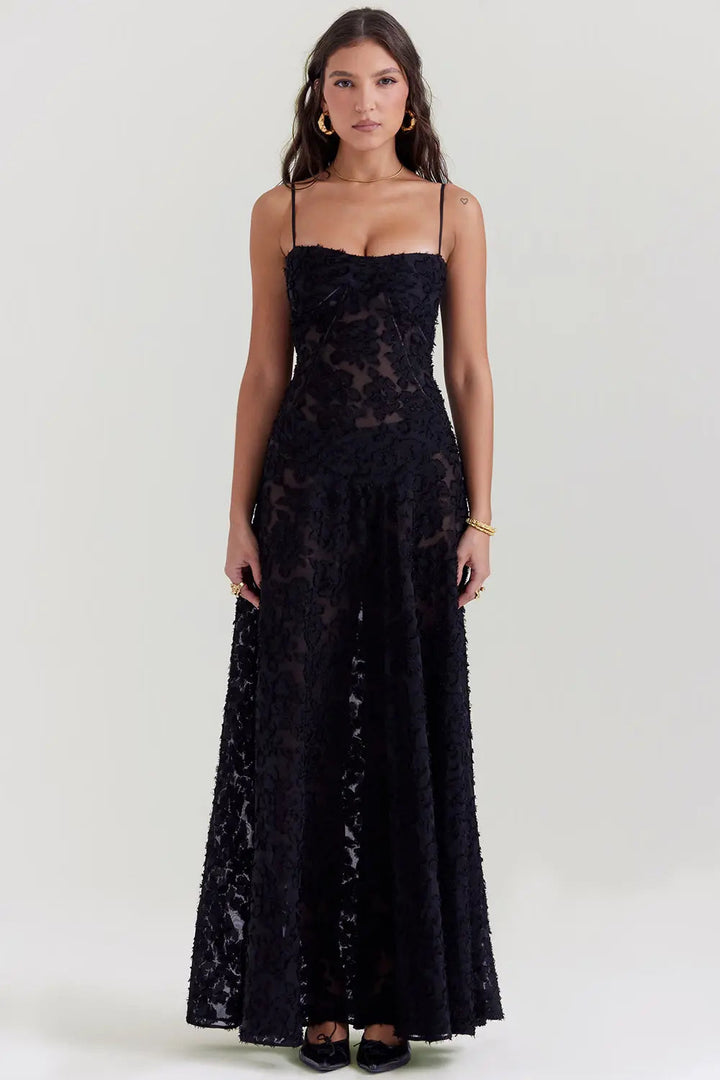 Woman wearing a black lace dress on a white background