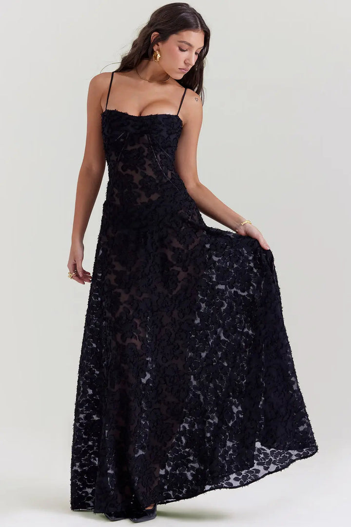 Woman wearing a black lace dress on a white background