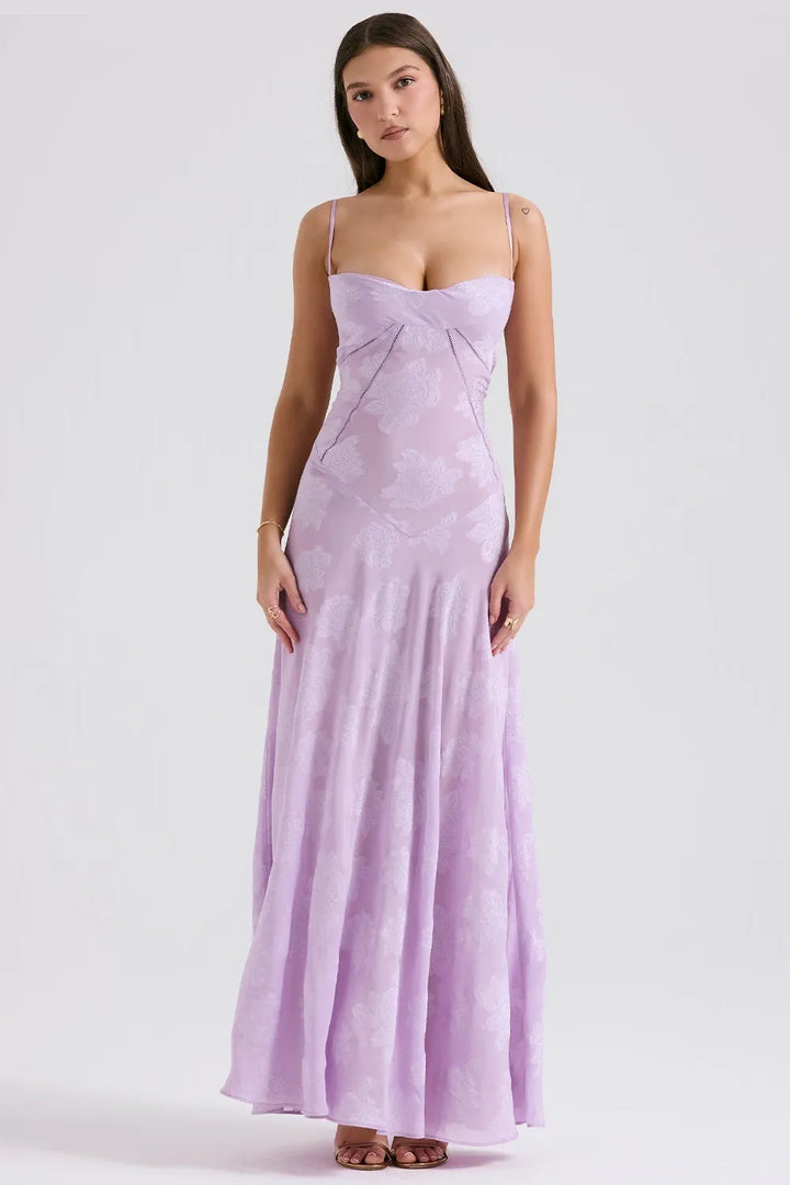 Woman wearing a purple strapless gown on a white background