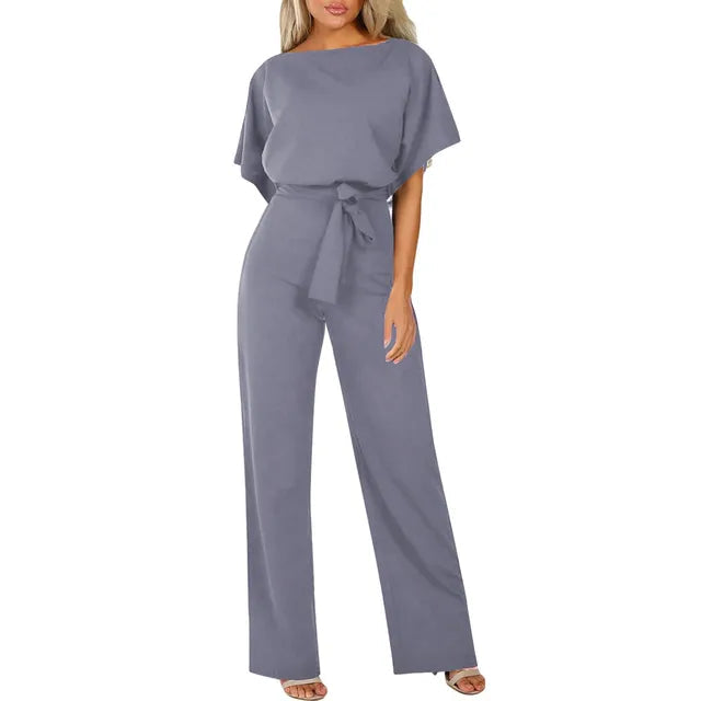 Gray jumpsuit worn by a model on a white background