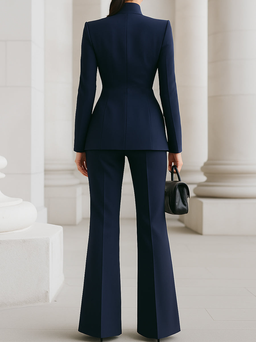 Person wearing a navy blue suit with a white background